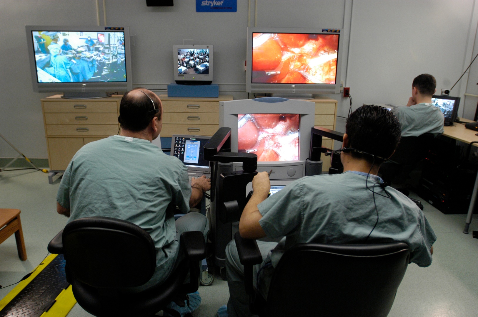 Doctors using telementoring equipment